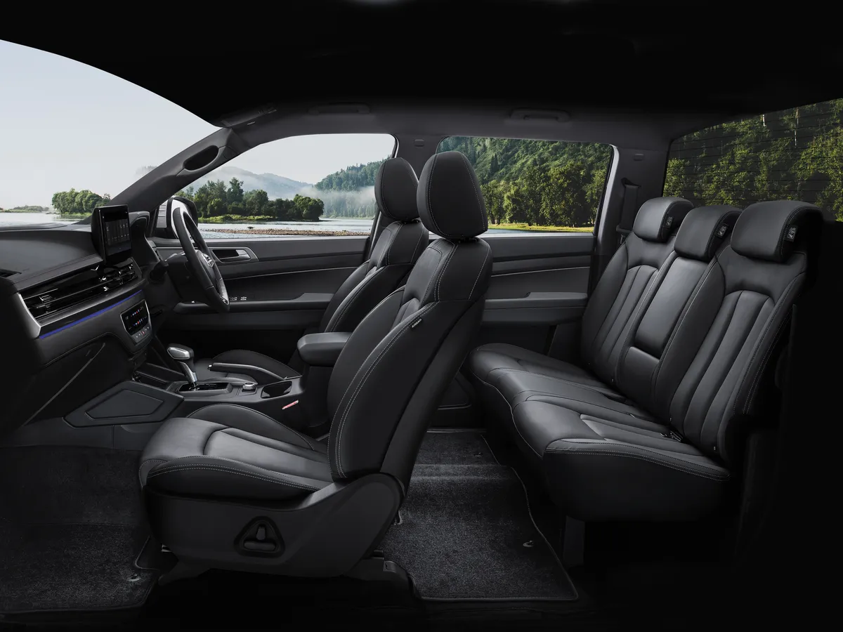 Black leather front and rear seats in a KGM Musso double cab